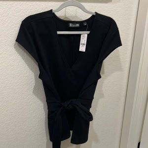 Brand new with tags, cute black shirt with a belt. Size XL.